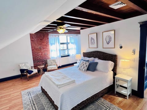 Primary bedroom with Queen bed, sofabed, ensuite bathroom