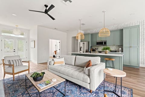 Living room + kitchen + entryway looking towards the Den/4th bedroom