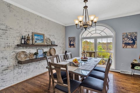 Savor your meals in a bright dining area with a view and ample seating for everyone.