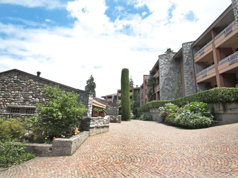 Cloud, Plant, Sky, Building, Road Surface, Neighbourhood, Facade, Landscape, City, Urban Design
