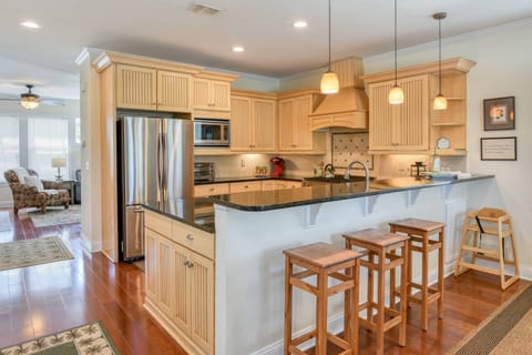 The open floor plan kitchen offers effortless flow, blending convenience with modern enjoyment.