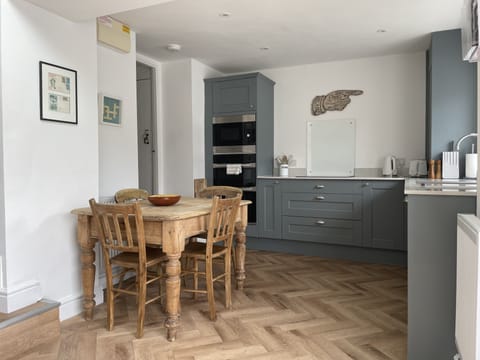 Kitchen - Double oven, induction hob, microwave.  Breakfast table