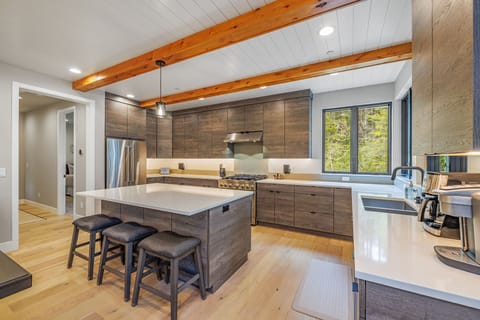 Gourmet Kitchen With Double Ovens, Range Hood And Designer Island