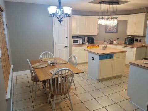 Comfortable kitchen nook for meals, coffee, and planning beach days.