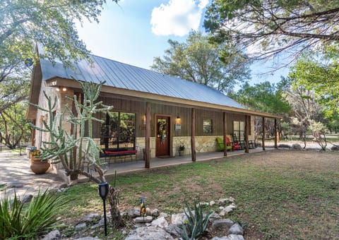 Front view of covered porch and yard