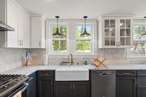 The kitchen has everything you need including a farmhouse sink &  a dishwasher!