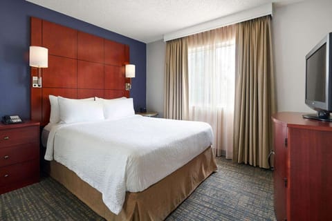 Unwind in crisp linens and a quiet, restful king bed.