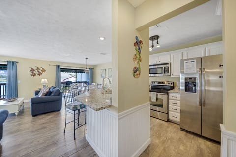 The fully equipped kitchen features granite countertops, stainless-steel appliances, and has everything you need to prepare meals for family and friends.
