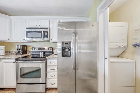 The fully equipped kitchen features granite countertops, stainless-steel appliances, and has everything you need to prepare meals for family and friends.