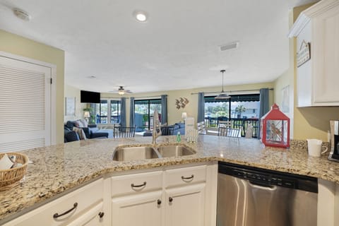 The fully equipped kitchen features granite countertops, stainless-steel appliances, and has everything you need to prepare meals for family and friends.