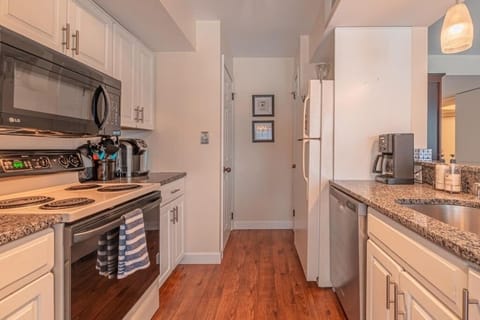 Fully stocked kitchen with Keurig coffee maker.