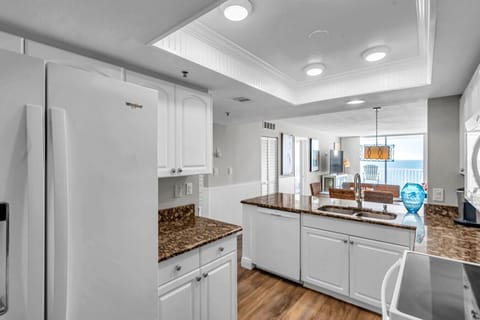 Bright kitchen w/ ample cabinetry, modern appliances, & an open, airy feel.