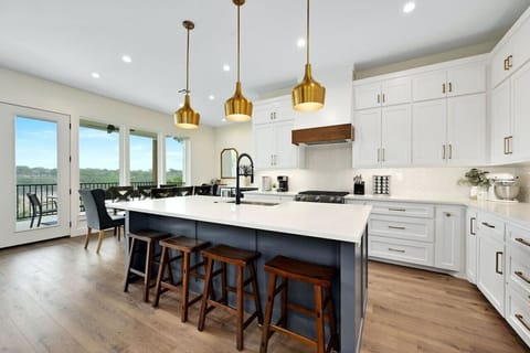 Gather around quartz island in this modern Lake Travis vacation rental