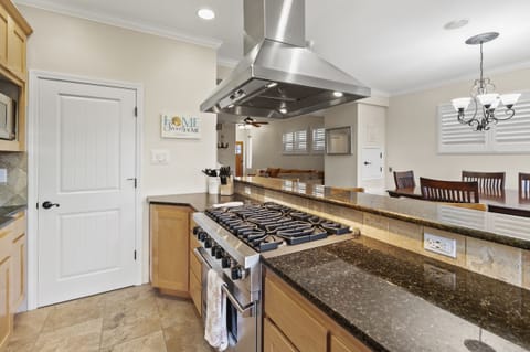 Top of the line kitchen with a beautiful 6 burner Viking stove.