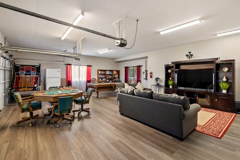 Game Room Entertainment Area with 65" Roku TV, Surround Sound, & Pandora Arcade 