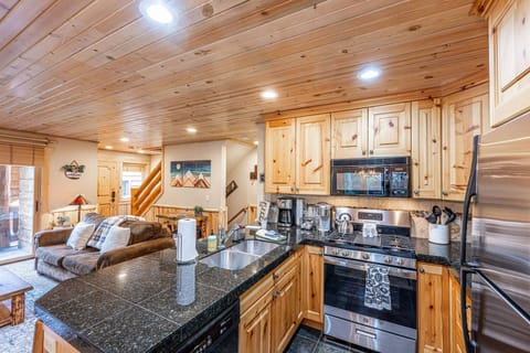 The fully stocked kitchen flows seemlessly to the living room of the home and has everything you need for a meal at home