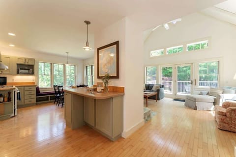 Central hallway leads to the living room, kitchen and dining areas.