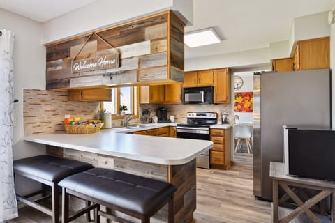 Kitchen is fully stocked. Has coffee bar w/ Keurig, snack basket, beverage frig