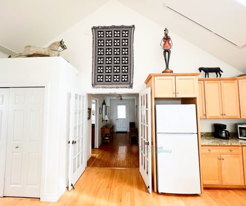 View from kitchen to front entry. - View from kitchen to front entry.