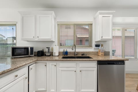 Bright, clean, and stocked! Ample counter space and all the cookware you'll need