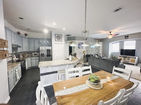 Open concept living room, dining and full kitchen