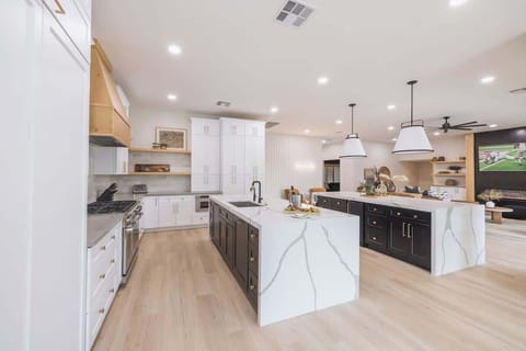 Fully stocked kitchen with an oversized island and bar seating.