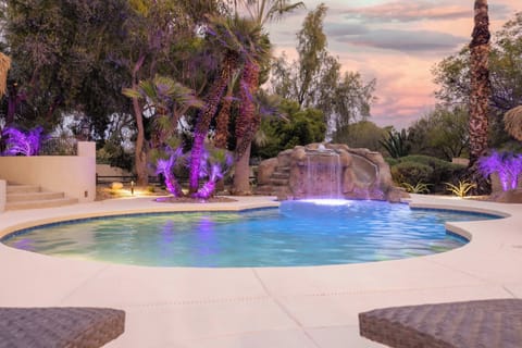 Take a dip in the resort-style pool with waterfall feature and glowing night lights