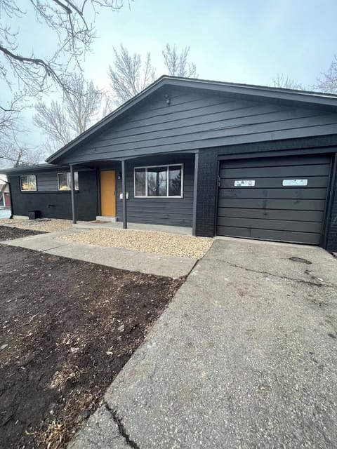 Front View of the House – A welcoming exterior showcasing the home’s charming features, including a well-maintained lawn and inviting entrance.