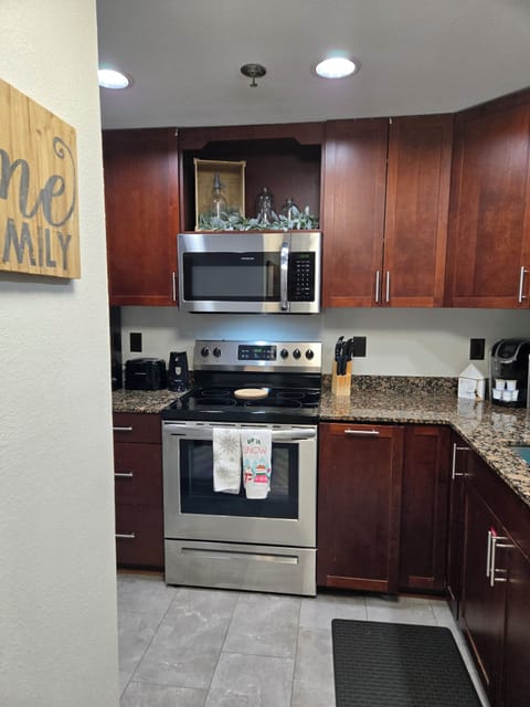 Kitchen features stainless steel appliances making meal prep a breeze.