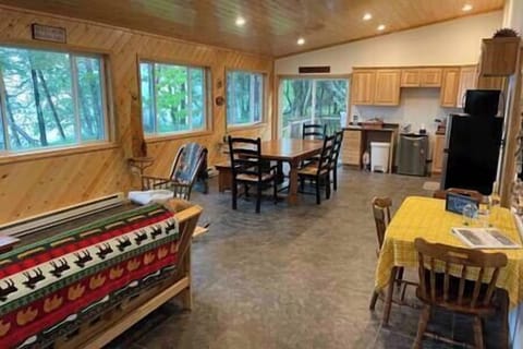 Spacious open concept living room/kitchen area with futon available to sleep 7 comfortably!