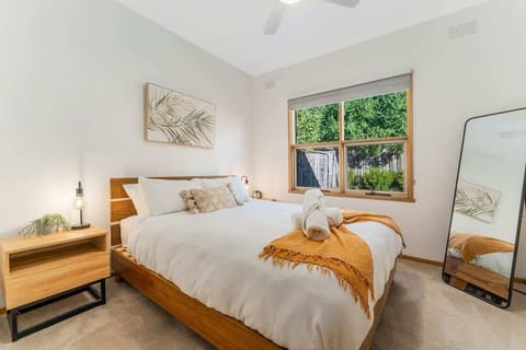 Bedroom with queen bed and garden views
