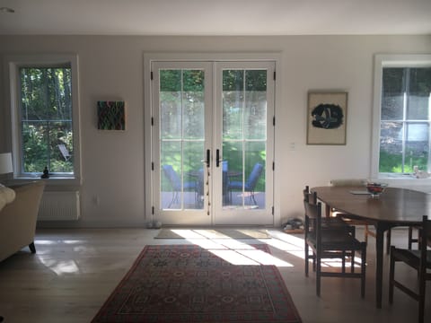 Open floorplan with French doors to private deck.