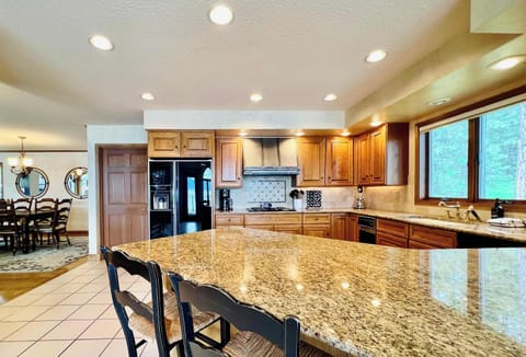 Large gathering Kitchen with bar and dining area