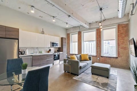 Urban chic with big windows, inviting decor, and city views for memorable hangouts!
