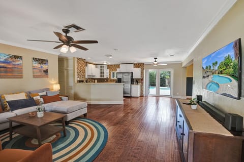 Open concept living room equipped with smart TV to stream your favorite shows