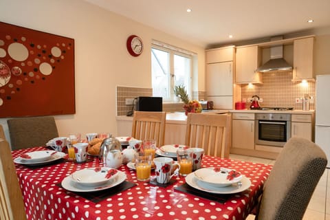 Heather Cottage table set for breakfast and kitchen