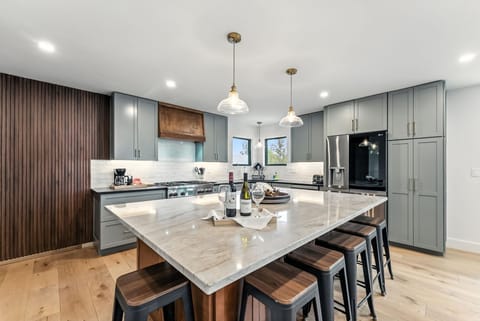 Kitchen: Drip coffee maker, Crockpot, blender, cooking utensils, tableware
