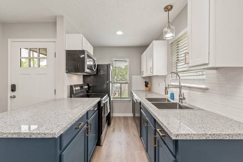 Stunning freshly renovated kitchen. NEW Granite counter tops, cabinets, fixtures AND appliances!