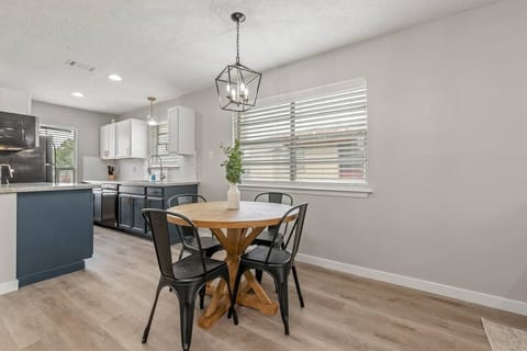 Hangout with friends and family at this beautiful dining table. Open concept lets you still talk to the cook while they prepare the meal!
