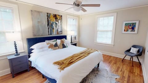 Main Bedroom with King mattress safe-rest encasement and fresh white linens.