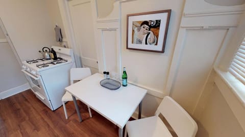 Kitchen with small table for eating or computer work.