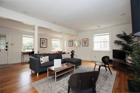 Large living Room with reading area and desk area.