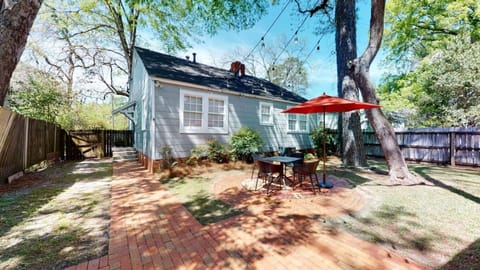 Cafe Lights twinkle at night or enjoy a gentle breeze at the patio table under the umbrella.