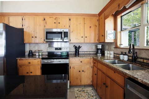 Kitchen features stainless steel appliances including an Electric Stove, dishwasher, and updated microwave.