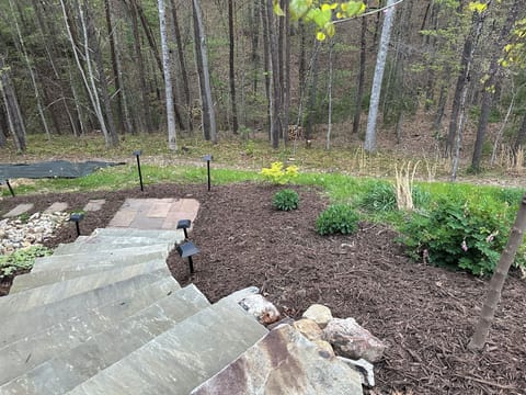 Stone steps from the parking area to entrance.