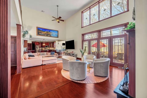 Easy, central access to the porch, hot tub, BBQ grill and screened-in porch