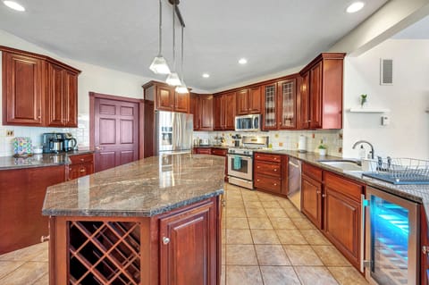 Wine fridge, coffee, tea, and lots of different serving utensils and cookware