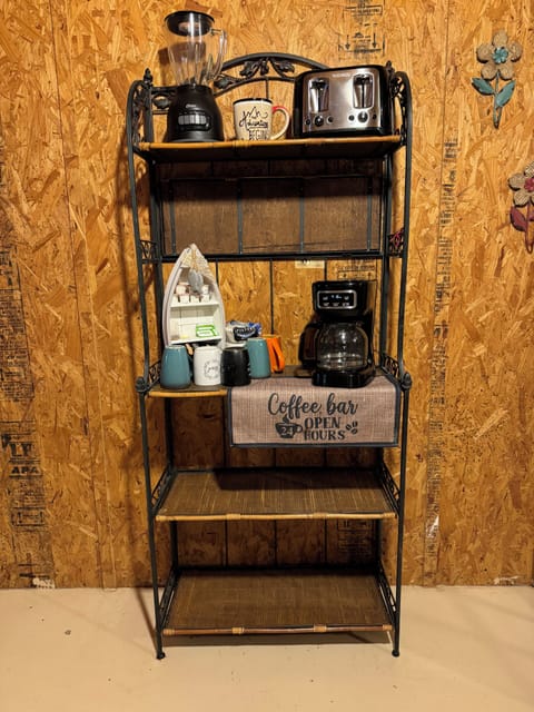 Coffee Bar with packets of coffee, creamers, sugars and tea. Toaster and blender