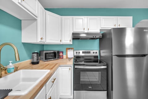 A generously sized kitchen, complete with the essential amenities and ample storage space for your culinary needs.