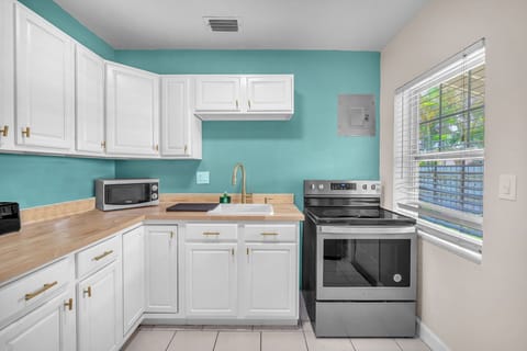 Spacious kitchen with plenty of cupboards for storage